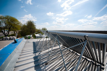 Vacuum solar water heating system on the house roof.