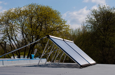 Vacuum solar water heating system on the house roof.