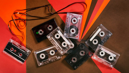 Vintage music cassette tape on retro background. Flat retro lay