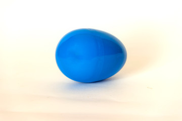 blue plastic egg on a white background