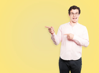 Amazed young man pointing at you with his finger