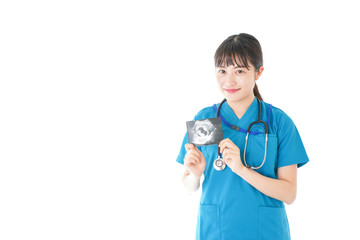 妊婦のエコー画像と笑顔の若いナース