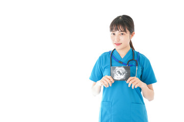 妊婦のエコー画像と笑顔の若いナース