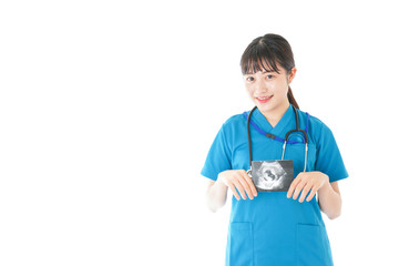 妊婦のエコー画像と笑顔の若いナース