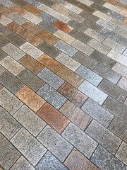 Wet pavement with stone tiles, background