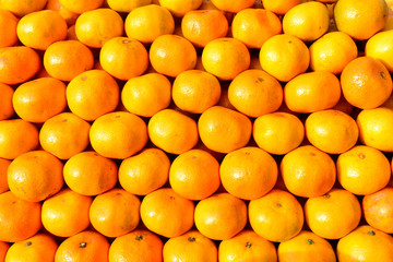 Many ripe oranges, put together