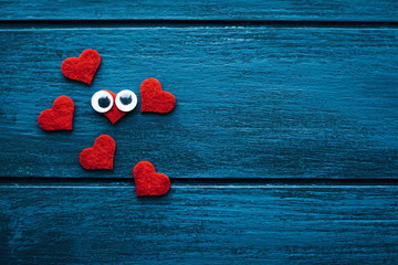 Small red hearts on wooden background. Valentines concept. Valetines background. - 314274883