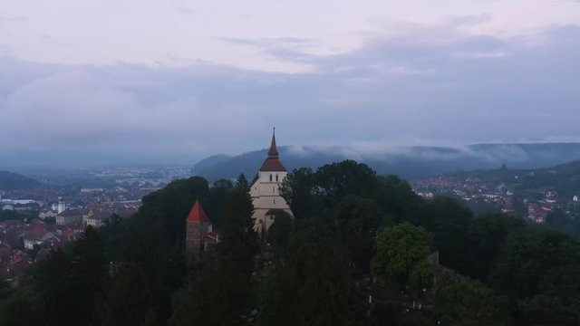 4k Aerial View Church on Hill Over By Romania T&acirc;rnava Mare River