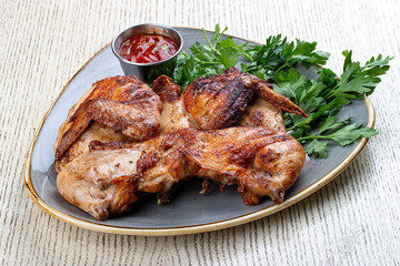 Tapaka chicken in a classic performance with.crispy garlic crust and Georgian sauce
