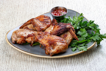 Tapaka chicken in a classic performance with.crispy garlic crust and Georgian sauce