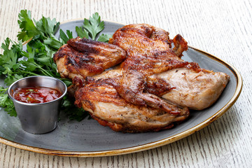 Tapaka chicken in a classic performance with.crispy garlic crust and Georgian sauce