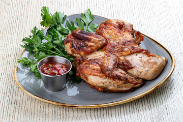 Tapaka chicken in a classic performance with.crispy garlic crust and Georgian sauce