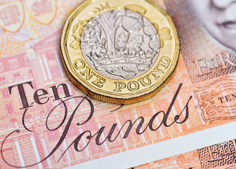 Pound Coin on a Ten Pound Note, British Currency, Close Up