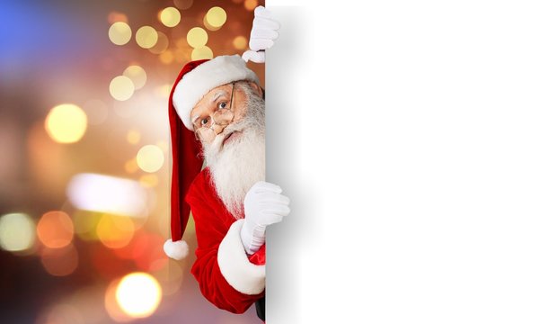 Santa Claus with a white paper poster on abstract background