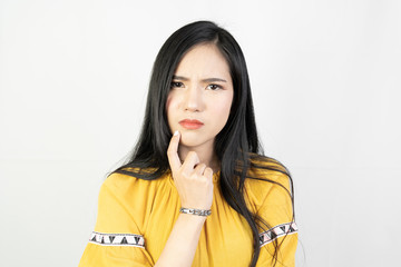 Portrait of young asian woman doing a thinking pose on with background.