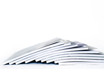 Stack books on a white background, soft focus	