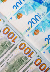 Israeli and American banknotes. Shekel and American dollars.