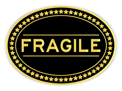 Black and gold color oval sticker with word fragile on white background