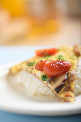 Minced pork omelette and rice on a paper plate to save the world