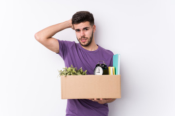 Young caucasian man moving a new home isolated being shocked, she has remembered important meeting.