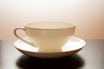 white tea cup and saucer