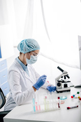 side view of genetic consultant doing dna test in lab