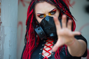  Woman cyberpunk. Beautiful young woman with piercing, dreads and stylish make-up. 