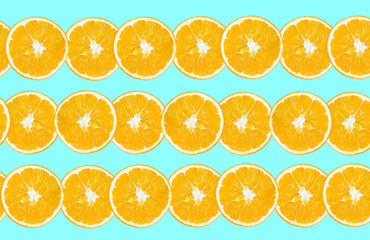 Fresh oranges cut in slice isolated on blue background. Healthy food. Fresh vitamins. Vegetarian.