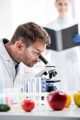 selective focus of molecular nutritionist using microscope in lab