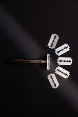 Razor and blade on the table. Stylish men set. Idea for a gift. Barber shop things.