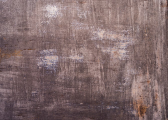 A sheet of iron exposed to rust. Old, shabby.