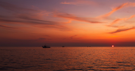 Boats. Sunset. Orange. Sea. Sky. Istria