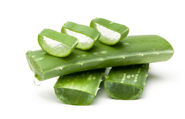 Aloe vera pieces of leaf isolated on white background. Drop of juice from leaf.