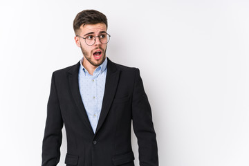 Young caucasian business man posing in a white background isolated Young caucasian business man being shocked because of something she has seen.