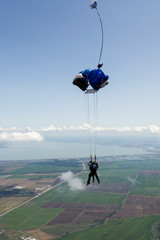 Tandem jump. The instructor and the student in free fall.