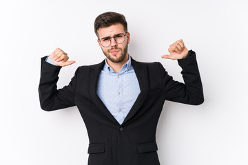 Young caucasian business man posing in a white background isolated Young caucasian business man feels proud and self confident, example to follow.