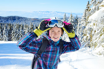 Young woman skier portrait outdoor in winter mountains - 314282643