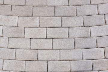 Outdoor walkway with white cobblestone.