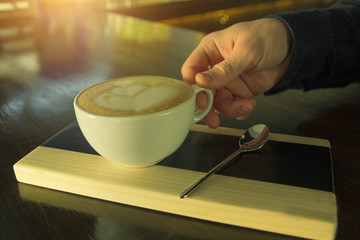 Coffee cup in coffee shop - vintage style effect picture