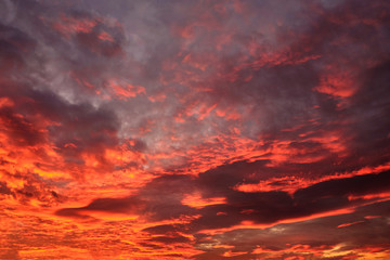 dramatic cloudy sky in the rays of setting sun