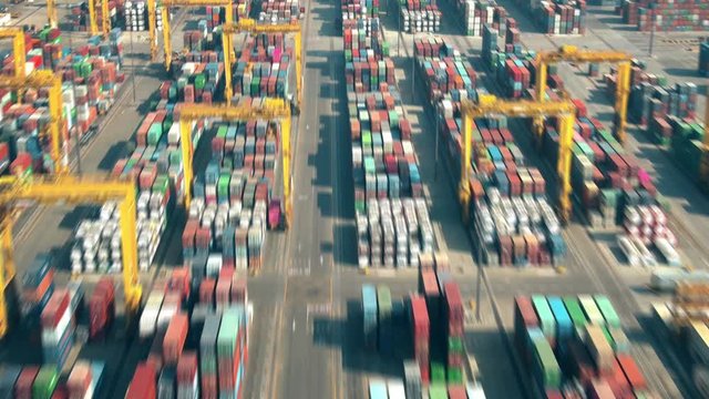 Aerial hyperlapse of a busy port container terminal