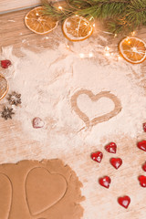 The concept of baking for Valentine's Day with torches in the shape of a heart and eggs. ginger cookies in the shape of a heart