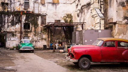 Classical Vintage Cars Parked in an Old Cuban Building