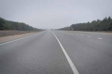 the abstract highway road in countryside in the fog rainy weather. danger driving, accident car crash