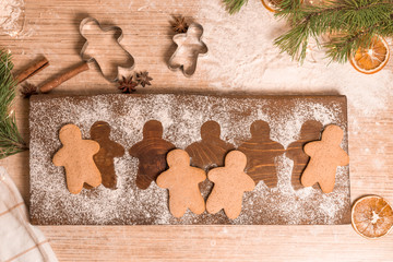 Gingerbread man cookies for Christmas holiday. the process of making ginger cookies . close-up, space for text