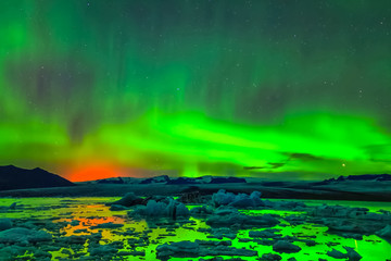 Aurora borealis in night northern sky. Ionization of air particl