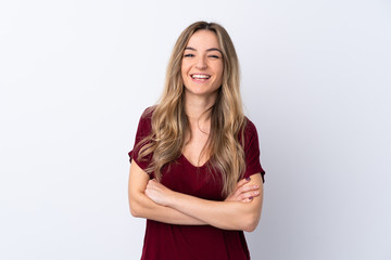 Obraz premium Young woman over isolated white background keeping the arms crossed in frontal position
