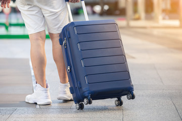 close up luggage with man walking,  travel concept.