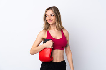 Fototapeta na wymiar Young sport woman over isolated white background with boxing gloves