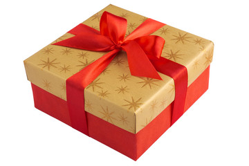 Red gift or present box with golden colored top and red ribbon bow isolated on white background